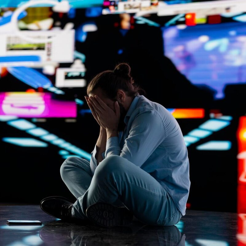 paranoid guy suffers from emotional damage caused by obsessive social media use 482257 126489